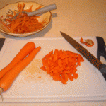 Peel and dice the carrots